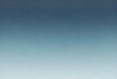 The primary subject of the image is the sky, which is a deep blue color. The setting is a vast, open space with no visible landmarks or objects. The visual style is a natural, outdoor scene with no indication of digital manipulation or artistic elements. The colors and mood convey a sense of tranquility and calmness, as the sky appears serene and unblemished.