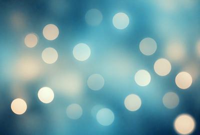 The primary subject of the image is a blue background with a pattern of white dots. The setting appears to be a night sky, creating a serene and peaceful atmosphere. The visual style of the image is a combination of a photo and digital art, as it features a blend of natural elements and artistic design. The colors and mood of the image are predominantly blue and white, with the white dots adding a touch of contrast and interest to the overall composition.