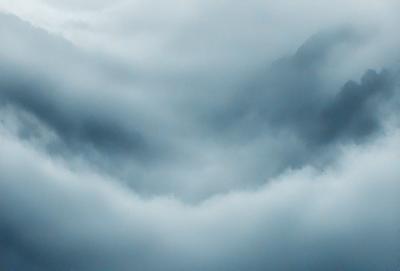 The primary subject of the image is a cloud formation, which appears to be shaped like a heart. The cloud is set against a blue sky, creating a visually striking scene. The visual style of the image is a photo, capturing the beauty of the cloud formation in its natural environment. The colors and mood of the image are predominantly blue, with the heart-shaped cloud adding a touch of warmth and love to the overall atmosphere.