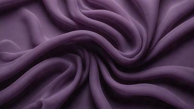 The primary subject of the image is a purple fabric, which is the main object, scene, or focus of the image. The setting or background is a purple sheet, and the visual style is a close-up of the fabric. The colors and mood of the image are predominantly purple, creating a calm and soothing atmosphere.