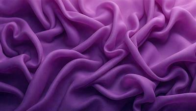The primary subject of the image is a purple fabric, which is the main object, scene, or focus of the image. The setting or background is a purple sheet, and the visual style is a close-up of the purple fabric. The colors and mood of the image are predominantly purple, creating a calm and soothing atmosphere.