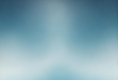 The primary subject of the image is a blue sky with a few clouds. The setting is a clear day with a cloudy sky. The visual style is a natural, outdoor scene. The colors and mood are calm and serene, with the blue sky and clouds creating a peaceful atmosphere.