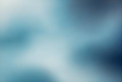 The primary subject of the image is a cloudy sky. The setting is a blue background, which creates a contrast with the cloudy sky. The visual style is a photo, capturing the natural beauty of the cloudy sky. The colors and mood of the image are predominantly blue, creating a calm and serene atmosphere.