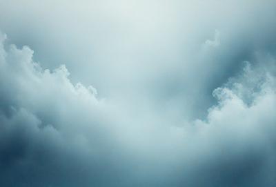 The primary subject of the image is a cloudy sky. The setting is a vast, open space with no visible landmarks or objects. The visual style is a natural, outdoor scene. The colors and mood are predominantly blue, with a slightly gloomy atmosphere.
