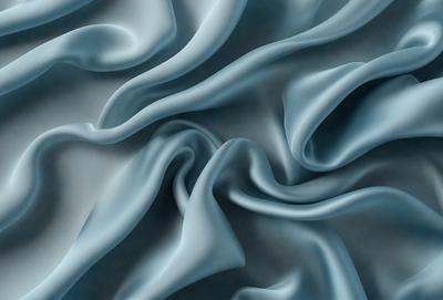 The primary subject of the image is a blue fabric, which appears to be a piece of cloth or a curtain. The setting is a room with a blue background, which creates a cohesive and visually appealing environment. The visual style of the image is a close-up of the blue fabric, showcasing its texture and details. The colors and mood of the image are predominantly blue, giving it a calm and serene atmosphere.