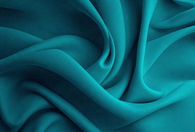 The primary subject of the image is a blue fabric, which appears to be a piece of cloth or a curtain. The setting is a dark background, which contrasts with the blue fabric. The visual style is a close-up of the blue fabric, showcasing its texture and pattern. The colors and mood of the image are predominantly blue, creating a calm and serene atmosphere.