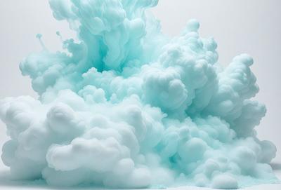 The primary subject of the image is a large, blue, foamy mass that appears to be a cloud or a bubble. The setting is a white background, which contrasts with the blue and white foamy mass. The visual style is a combination of a photo and digital art, creating a unique and interesting visual effect. The dominant colors are blue and white, with the blue foamy mass being the main focus of the image. The overall atmosphere is one of creativity and artistic expression.