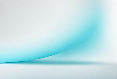 The primary subject of the image is a blue, curved, and wavy surface. The setting is a white background, which creates a striking contrast with the blue surface. The visual style appears to be a digital art or illustration, as the blue surface has a smooth and flowing appearance. The colors and mood of the image are predominantly blue, creating a sense of calmness and tranquility.