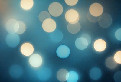 The primary subject of the image is a blue background with a large number of bright, white lights. The lights are scattered throughout the background, creating a visually striking and luminous scene. The visual style of the image is a combination of digital art and illustration, as the lights are depicted in a way that resembles a digital artwork or a painting. The colors and mood of the image are predominantly blue and white, with the bright lights adding a sense of energy and dynamism to the scene.