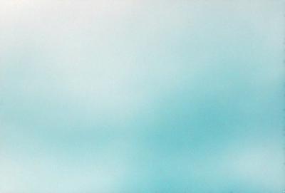 The primary subject of the image is a large, open sky with a cloudy blue background. The setting is a vast, cloudy expanse, and the visual style is a natural, outdoor atmosphere. The colors and mood of the image are predominantly blue, with a slightly cloudy and serene ambiance.