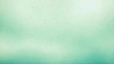 The primary subject of the image is a large, empty, and cloudy sky. The setting is a vast, open space with no visible landmarks or objects. The visual style is a natural, outdoor scene with a focus on the sky. The colors and mood of the image are predominantly green, with a slightly overcast and moody atmosphere.