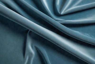 The primary subject of the image is a blue fabric, which is the main object, scene, or focus of the image. The setting or background is a blue cloth, and the visual style is a photo. The dominant colors and overall atmosphere are blue and calm.