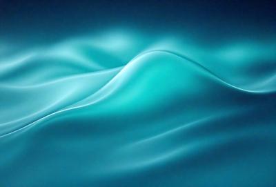 The primary subject of the image is a wave in the ocean. The wave is blue and appears to be curling over, creating a dynamic and visually appealing scene. The setting is the ocean, with the wave being the main focus of the image. The visual style is a photo, capturing the natural beauty of the ocean and its waves. The dominant colors are blue, creating a serene and calming atmosphere.