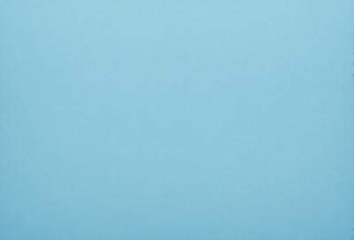 The primary subject of the image is a large, empty, and dark blue sky. The setting is a vast, open space with no visible landmarks or objects. The visual style is a natural, untouched, and unaltered representation of the sky. The colors and mood convey a sense of tranquility and vastness.