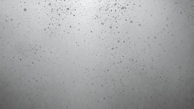 The primary subject of the image is a white background with a pattern of black dots. The setting is a foggy environment, creating a moody atmosphere. The visual style is a combination of a photo and digital art, as the dots are arranged in a way that resembles a digital artwork. The colors are predominantly black and white, with the black dots contrasting against the white background.