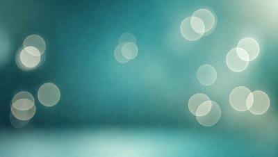 The primary subject of the image is a blue background with a pattern of white lights. The setting appears to be a dark room, and the visual style is a combination of a photo and digital art. The dominant colors are blue and white, creating a calm and serene atmosphere.