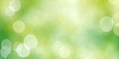 The primary subject of the image is a green background with a few green leaves. The setting is a natural environment, possibly a forest or a garden. The visual style is a combination of a photo and a digital art, creating a unique and artistic representation of the scene. The colors and mood are predominantly green, giving the image a calm and serene atmosphere.