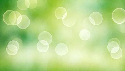 The primary subject of the image is a close-up of a green background with a pattern of green and white circles. The setting appears to be a natural environment, possibly a forest or a garden. The visual style of the image is a combination of a photo and a digital art, creating a unique and artistic representation of the green background. The colors and mood of the image are predominantly green, giving it a fresh and lively atmosphere.