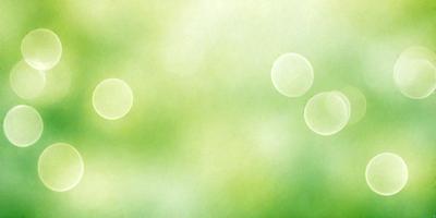 The image features a lush green field with two large, round, white bubbles floating in the air. The field appears to be a part of a larger, more complex scene, possibly a painting or digital artwork. The colors and mood of the image are predominantly green, creating a serene and natural atmosphere.