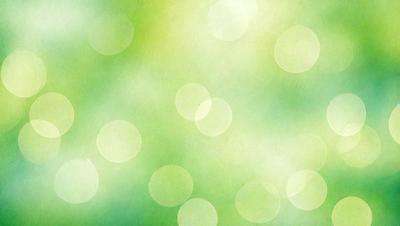 The primary subject of the image is a green background with a pattern of circles. The setting is a bright and lively environment, possibly a garden or a field. The visual style is a combination of a photo and a digital art, creating a unique and vibrant atmosphere. The dominant colors are green and white, with the green background and the white circles, which contribute to a fresh and natural mood.