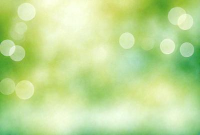 The primary subject of the image is a bright, colorful, and lush green background. The setting is a field of grass, and the visual style is a combination of a photo and digital art. The colors and mood of the image are vibrant and serene, with the green grass and bright light creating a sense of tranquility and natural beauty.