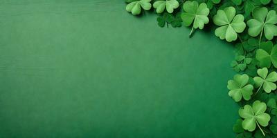 The primary subject of the image is a green background with a shamrock design. The setting is a green surface, possibly a wall or a piece of fabric. The visual style is a digital art or illustration, as the shamrock design is created with a computer or digital tools. The colors and mood of the image are predominantly green, which is associated with luck, prosperity, and good fortune.