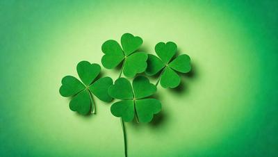The primary subject of the image is a close-up of four green shamrocks, each with a heart shape in the center. The shamrocks are placed on a green background, which creates a vibrant and lively atmosphere. The visual style of the image is a combination of photo and digital art, as it appears to be a close-up of a real shamrock, yet the background is green and the shamrocks are arranged in a way that suggests digital manipulation. The colors and mood of