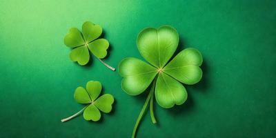 The primary subject of the image is a close-up of a green four-leaf clover. The setting is a green background, which creates a vibrant and lively atmosphere. The visual style is a photo, capturing the details of the clover. The colors and mood are predominantly green, symbolizing growth, renewal, and good fortune.