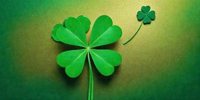 The primary subject of the image is a close-up of a green four-leaf clover. The setting is a green background, and the visual style is a photo. The dominant colors are green and gold, creating a lively and vibrant atmosphere.