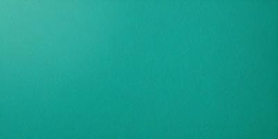 The primary subject of the image is a large, empty, and brightly colored wall. The setting is a room with a blue wall, and the visual style is a photo. The dominant colors are blue and green, creating a calm and serene atmosphere.