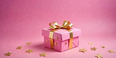 The primary subject of the image is a pink box with a gold bow on top. The box is placed on a pink background, which creates a visually appealing contrast. The visual style of the image is a combination of photo and digital art, as it appears to be a close-up of the box with a slightly blurred background. The colors and mood of the image are predominantly pink and warm, giving it a sense of celebration or gift-giving.
