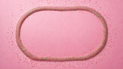 The primary subject of the image is a pink surface with a white border. The setting is a pink background, and the visual style is a photo. The colors and mood of the image are predominantly pink and white, creating a warm and inviting atmosphere.