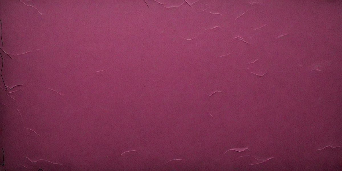 The primary subject of the image is a close-up of a red leather surface. The setting is a room with a wall painted in a shade of red. The visual style is a photo, and the dominant colors are red and pink. The overall atmosphere is warm and inviting.