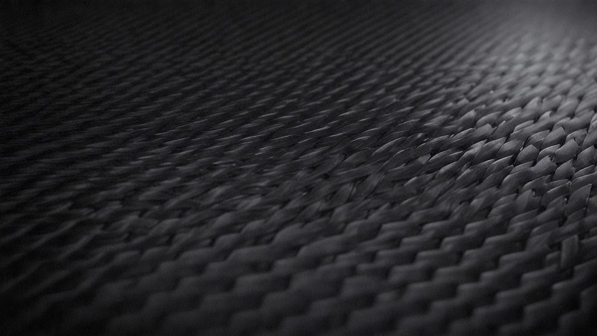 11f99cee-4b40-4497-9be1-2f8355f9891c-freepik__dark-carbon-fiber-background-cinematic-angle-compo__2332_250525074502_00001.png