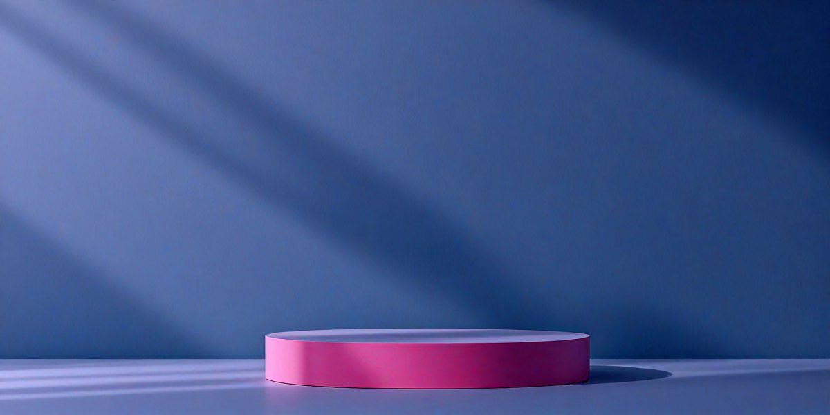 The primary subject of the image is a pink and purple square, which is placed on a white surface. The setting is a blue wall, and the visual style appears to be a photo. The colors and mood of the image are predominantly pink and purple, creating a warm and inviting atmosphere.
