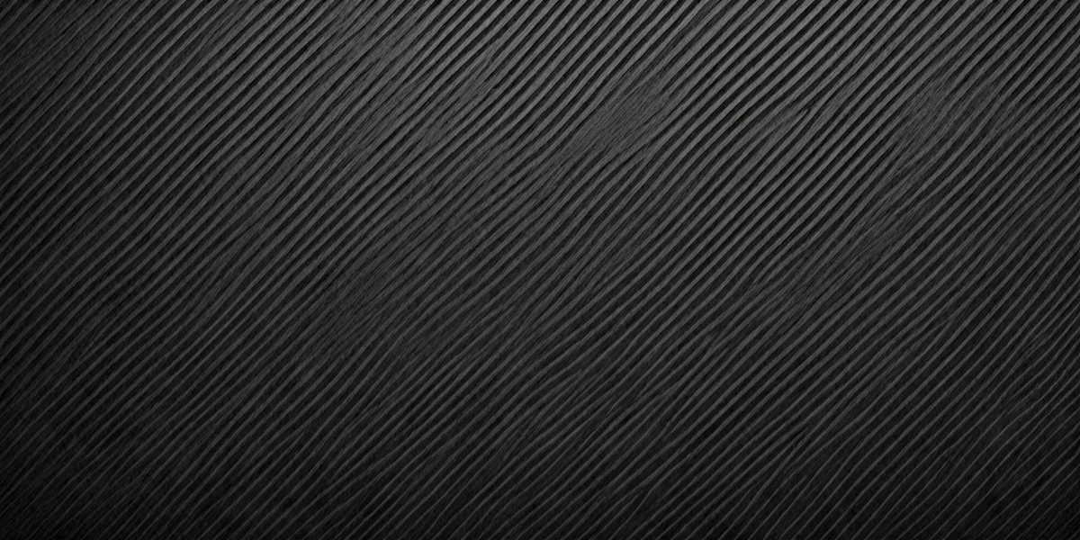 The primary subject of the image is a black background with a pattern of black and white stripes. The setting is a dark room, and the visual style is a close-up of the black and white pattern. The colors and mood of the image are predominantly dark and moody, with the black and white stripes creating a sense of depth and contrast.