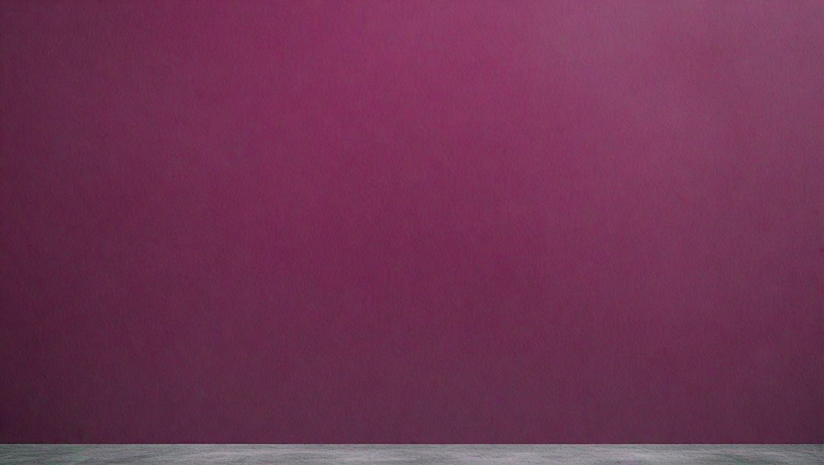 The primary subject of the image is a purple wall. The setting is a room with a purple wall, and the visual style is a photo. The dominant colors in the image are purple and pink, creating a calm and soothing atmosphere.