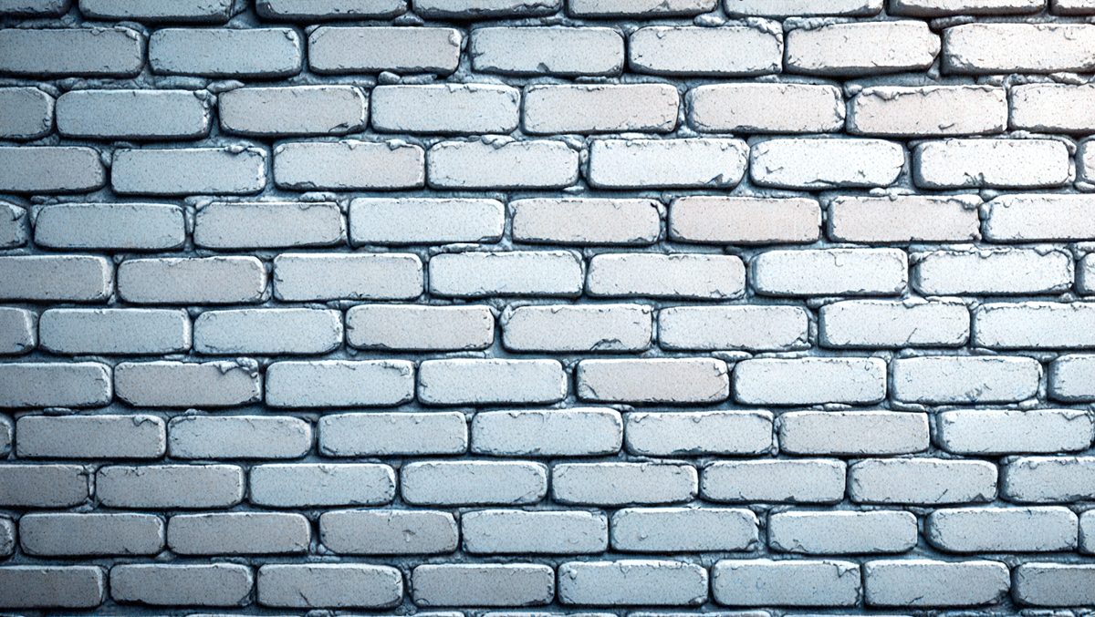The primary subject of the image is a brick wall. The setting is a brick wall with a blue background. The visual style is a photo of a brick wall. The colors and mood of the image are predominantly blue, giving it a calm and serene atmosphere.