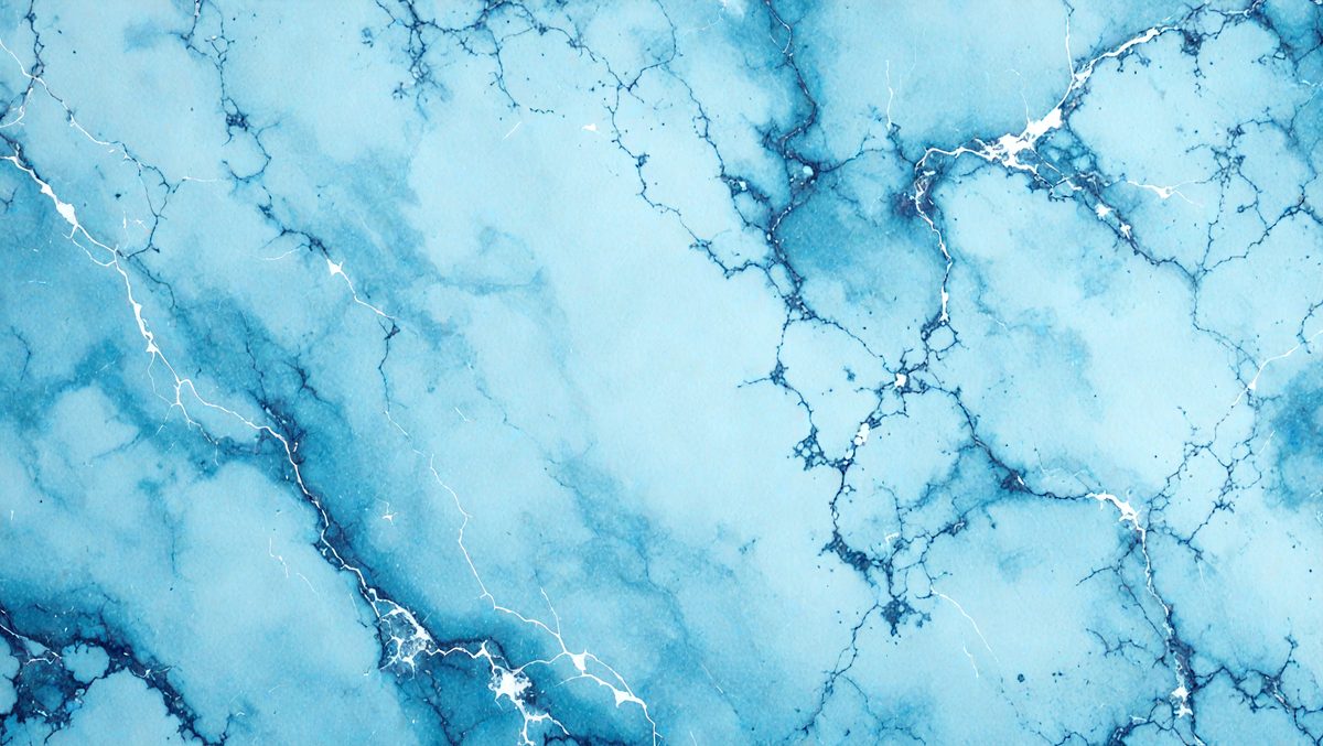 The primary subject of the image is a blue and white marbled wall. The setting is a room with a blue and white marbled wall, which serves as the background. The visual style is a photo, capturing the intricate patterns and textures of the marbled wall. The dominant colors are blue and white, creating a calm and soothing atmosphere.
