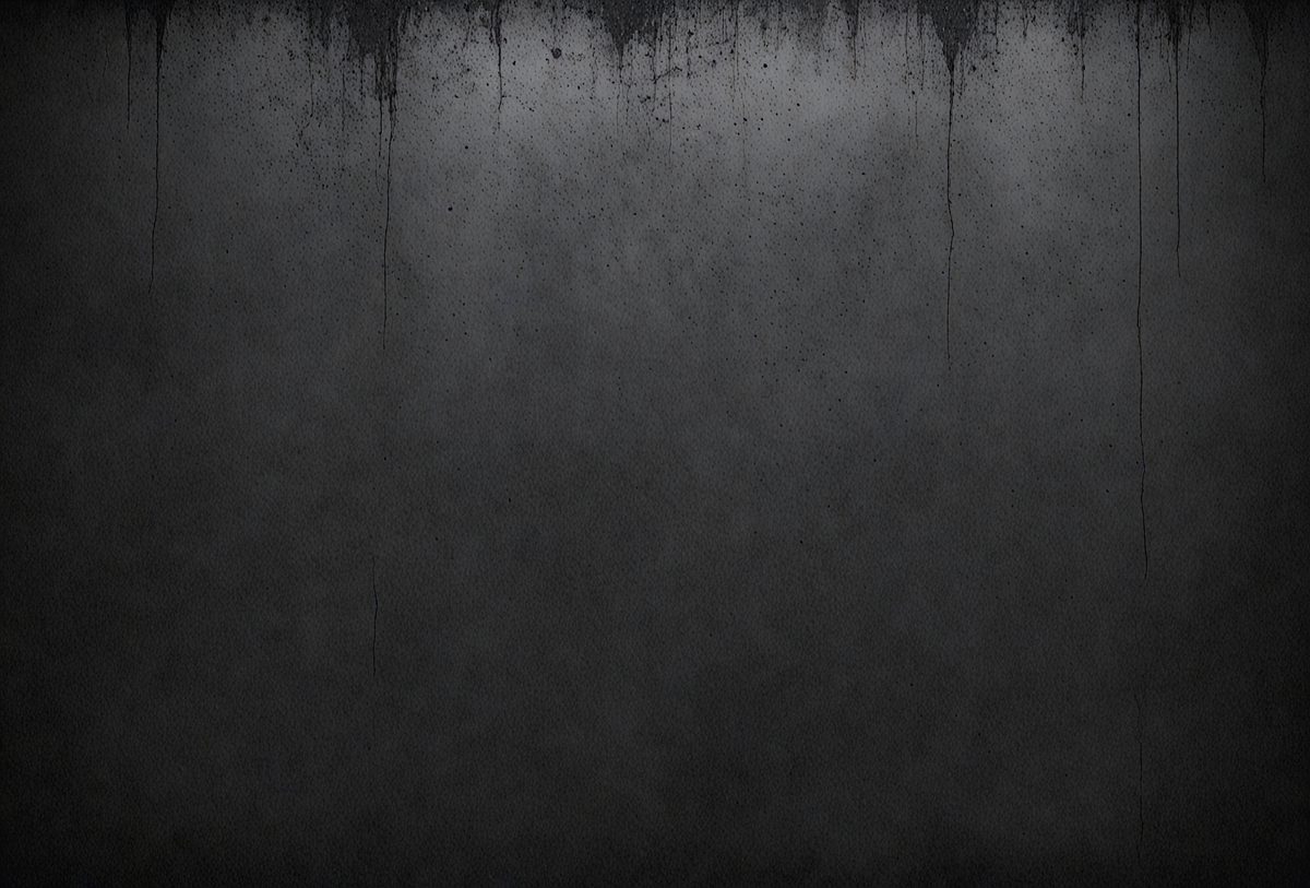 The primary subject of the image is a gray wall with a textured surface. The setting is a room with a gray background. The visual style is a black and white photo. The dominant colors are gray, and the overall atmosphere is moody and dramatic.