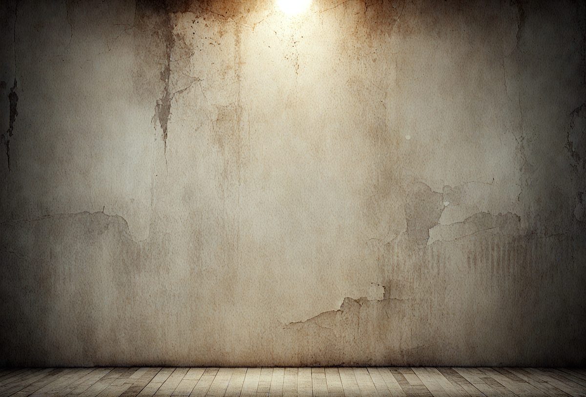 The primary subject of the image is a large, dirty, and peeling wall. The setting is a room with a wooden floor. The visual style is a photo, and the colors and mood are dark and dingy.