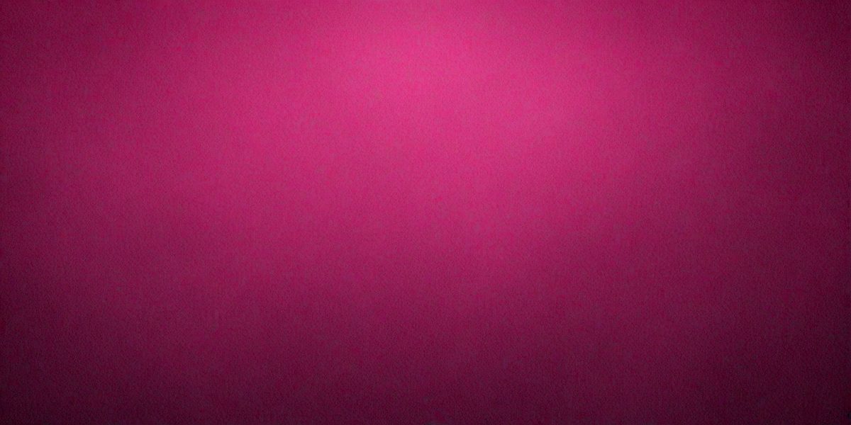 The primary subject of the image is a large, pink wall. The setting is a room with a pink background, and the visual style is a close-up of the wall. The dominant colors in the image are pink, and the overall atmosphere is warm and inviting.