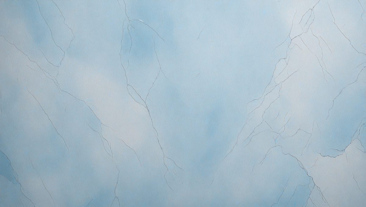 The primary subject of the image is a blue and white painting of a rocky surface. The setting is a cloudy sky, and the visual style appears to be a digital art or illustration. The dominant colors are blue and white, creating a calm and serene atmosphere.