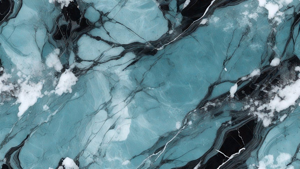 The primary subject of the image is a large, blue, marbled stone. The setting is a black and white photograph, which gives the image a classic and timeless appearance. The visual style is a close-up of the marbled stone, emphasizing its unique texture and pattern. The colors and mood of the image are predominantly black and white, creating a sense of depth and contrast.