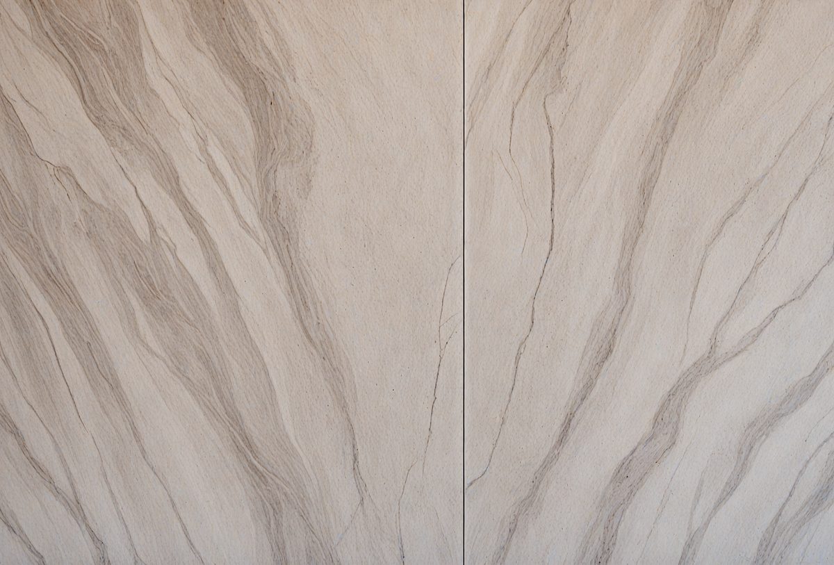 The primary subject of the image is a wall with a marble texture. The setting is a room with a white color scheme. The visual style is a close-up of the wall, showcasing the marble texture. The colors and mood of the image are predominantly white, giving it a clean and elegant appearance.